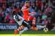 SOUTHAMPTON, ENGLAND - MARCH 15: Daniel Sanchez Ayala of Norwich City tackles Morgan Schneiderlin of Southampton during the Barclays Premier League match between Southampton and Norwich City at St Mary's Stadium on March 15, 2014 in Southampton, England.