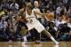 May 8, 2014; San Antonio, TX, USA; San Antonio Spurs forward Kawhi Leonard (2) posts up against Portland Trail Blazers guard Damian Lillard (left) in game two of the second round of the 2014 NBA Playoffs at AT&T Center. Mandatory Credit: Soobum Im-USA TOD