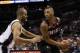 May 8, 2014; San Antonio, TX, USA; Portland Trail Blazers guard Damian Lillard (right) is defended by San Antonio Spurs guard Tony Parker (left) in game two of the second round of the 2014 NBA Playoffs at AT&T Center. Mandatory Credit: Soobum Im-USA TODAY