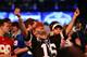 NEW YORK, NY - MAY 08: A fan reacts as Johnny Manziel of the Texas A&M Aggies is picked #22 overall by the Cleveland Browns during the first round of the 2014 NFL Draft at Radio City Music Hall on May 8, 2014 in New York City. (Photo by Elsa/Getty Image