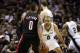 May 6, 2014; San Antonio, TX, USA; Portland Trail Blazers guard Damian Lillard (0) is defended by San Antonio Spurs guard Tony Parker (9) in game one of the second round of the 2014 NBA Playoffs at AT&T Center. The Spurs won 116-92. Mandatory Credit: Soob