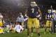 Oct 19, 2013; South Bend, IN, USA; Notre Dame Fighting Irish defensive end Stephon Tuitt (7) celebrates after sacking USC Trojans quarterback Cody Kessler (6) in the third quarter at Notre Dame Stadium. Notre Dame won 14-10. Mandatory Credit: Matt Cashore