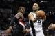 May 6, 2014; San Antonio, TX, USA; San Antonio Spurs guard Tony Parker (9) drives to the basket past Portland Trail Blazers forward LaMarcus Aldridge (12) in game one of the second round of the 2014 NBA Playoffs at AT&T Center. Mandatory Credit: Soobum Im
