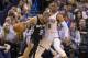 OKLAHOMA CITY, OK - April 3, 2014: Tony Parker #9 of the San Antonio Spurs drives against Russell Westbrook #0 of the Oklahoma City Thunder at the Chesapeake Arena on April 3, 2014 in Oklahoma City, Oklahoma. NOTE TO USER: User expressly acknowledges and