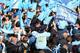 MANCHESTER, ENGLAND - MAY 12: Supporters of Manchester City wait outside Manchester Town Hall prior to the start of the Manchester City victory parade around the streets of Manchester on May 12, 2014 in Manchester, England. (Photo by Alex Livesey/Getty