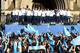 MANCHESTER, ENGLAND - MAY 12: The players of Manchester City salute their supporters outside Manchester Town Hall at the start of the Manchester City victory parade around the streets of Manchester on May 12, 2014 in Manchester, England. (Photo by Alex