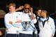 MANCHESTER, ENGLAND - MAY 12: Vincent Kompany, Gael Clichy and Joe Hart of Manchester City look on outside Manchester Town Hall at the start of the Manchester City victory parade around the streets of Manchester on May 12, 2014 in Manchester, England. (