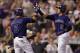 DENVER, CO - MAY 05: Troy Tulowitzki #2 of the Colorado Rockies celebrates his two run home run off of starting pitcher Martin Perez #33 of the Texas Rangers with Carlos Gonzalez #5 of the Colorado Rockies to give the Rockies a 5-0 lead in the fifth inni