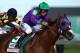 LOUISVILLE, KY - MAY 03: Jockey Victor Espinoza guides California Chrome #5 to the finish line to win the 140th running of the Kentucky Derby at Churchill Downs on May 3, 2014 in Louisville, Kentucky. (Photo by Andy Lyons/Getty Images)
