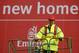 LONDON - OCTOBER 5: Manager Arsene Wenger of Arsenal poses outside Arsenal Football Club's new Emirates Stadium development at Ashburton Grove on October 5, 2004 in London. Arsenal have just announced the stadium will be called the Emirates Stadium for