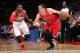 Bull guard Kirk Hinrich attempts to drive past Wizards player John Wall.