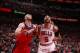 Bulls forward Carlos Boozer battles Wizards center Marcin Gorat for position.
