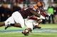 Dec 28, 2012; Orlando, FL, USA; Virginia Tech Hokies defensive tackle Luther Maddy (92) and Virginia Tech Hokies linebacker Alonzo Tweedy (28) tackle Rutgers Scarlet Knights wide receiver Miles Shuler (14) during the first quarter of the 2012 Russell Athl