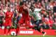 LIVERPOOL, ENGLAND - MARCH 30: Luis Suarez of Liverpool competes with Danny Rose of Tottenham Hotspur during the Barclays Premier League match between Liverpool and Tottenham Hotspur at Anfield on March 30, 2014 in Liverpool, England. (Photo by Alex Liv