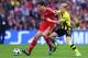 LONDON, ENGLAND - MAY 25: Javi Martinez of Bayern Muenchen (L) in action with Marco Reus of Borussia Dortmund during the UEFA Champions League final match between Borussia Dortmund and FC Bayern Muenchen at Wembley Stadium on May 25, 2013 in London, Unit