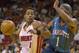 Rod Strickland drives on Baron Davis in 2002.