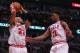 May 10, 2013; Chicago, IL, USA; Chicago Bulls power forward Taj Gibson (22) with a rebound over small forward Jimmy Butler (21) during the second quarter in game three of the second round of the 2013 NBA Playoffs against the Miami Heat at the United Cente