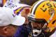 LSU head coach Les Miles (left) shares a moment with quarterback Anthony Jennings (right).
