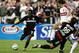 WASHINGTON - APRIL 09: Freddy Adu #9 of DC United takes a shot on goal past teammate Jaime Moreno #99 and Kelly Gray #6 of the Chicago Fire as DC United deteated the Fire 1-0 during MLS action at Robert F. Kennedy Stadium on April 9, 2005 in Washington,