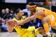 Mar 28, 2014; Indianapolis, IN, USA; Michigan Wolverines forward Jordan Morgan (left) tries to keep control of the ball while defended by Tennessee Volunteers forward Jarnell Stokes (right) in the first half in the semifinals of the midwest regional of th