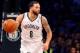 May 10, 2014; Brooklyn, NY, USA; Brooklyn Nets guard Deron Williams (8) advances the ball during the fourth quarter against the Miami Heat in game three of the second round of the 2014 NBA Playoffs at Barclays Center. Brooklyn Nets won 104-90. Mandatory