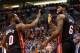 PHOENIX, AZ - FEBRUARY 11: LeBron James #6 of the Miami Heat high fives Toney Douglas #0 after scoring against the Phoenix Suns during the second half of the NBA game at US Airways Center on February 11, 2014 in Phoenix, Arizona. The Heat defeated the S