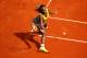 PARIS, FRANCE - MAY 25: Serena Williams of the United States returns a shot during her women's singles match against Alize Lim of France on day one of the French Open at Roland Garros on May 25, 2014 in Paris, France. (Photo by Clive Brunskill/Getty Ima