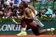 PARIS, FRANCE - MAY 25: Serena Williams of the United States reacts during her women's singles match against Alize Lim of France on day one of the French Open at Roland Garros on May 25, 2014 in Paris, France. (Photo by Matthias Hangst/Getty Images)