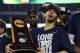 Apr 7, 2014; Arlington, TX, USA; Connecticut Huskies guard Shabazz Napier (13) holds the national championship trophy after defeating the Kentucky Wildcats in the championship game of the Final Four in the 2014 NCAA Mens Division I Championship tournament