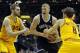 Apr 12, 2014; Cleveland, OH, USA; Brooklyn Nets forward Mason Plumlee (center) drives between Cleveland Cavaliers center Tyler Zeller (left) and guard Matthew Dellavedova (8) in the first quarter at Quicken Loans Arena. Mandatory Credit: David Richard-USA