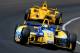 INDIANAPOLIS, IN - MAY 25: Marco Andretti, driver of the #25 Snapple Andretti Autosport Honda Dallara, leads Helio Castroneves of Brazil, driver of the #3 Pennzoil Ultra Platinum Penske Chevrolet Dallara, during the 98th running of the Indianapolis 500 at