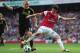 LONDON, ENGLAND - APRIL 17: Jay Spearing of Liverpool tackles Cesc Fabregas of Arsenal and gives away a penalty kick during the Barclays Premier League match between Arsenal and Liverpool at the Emirates Stadium on April 17, 2011 in London, England. (Ph