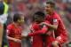 LIVERPOOL, ENGLAND - AUGUST 17: Daniel Sturridge of Liverpool is congratulated by Iago Aspas,Lucas,Philuppe Coutinho and Kolo Toure after scoring the first goal during the Barclays Premier League match between Liverpool and Stoke City at Anfield on Augus