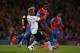 LONDON, ENGLAND - MAY 05: Glen Johnson of Liverpool and Yannick Bolasie of Crystal Palace compete for the ball during the Barclays Premier League match between Crystal Palace and Liverpool at Selhurst Park on May 5, 2014 in London, England. (Photo by Cl