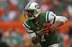 MIAMI GARDENS, FL - DECEMBER 29: Geno Smith #7 of the New York Jets rushes during a game against the Miami Dolphins at Sun Life Stadium on December 29, 2013 in Miami Gardens, Florida. (Photo by Mike Ehrmann/Getty Images)