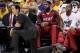 May 28, 2014; Indianapolis, IN, USA; Miami Heat head coach Erik Spoelstra kneels courtside with forward LeBron James (6) sitting on the bench during the second half in game five against the Indiana Pacers of the Eastern Conference Finals of the 2014 NBA