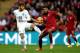 LONDON, ENGLAND - MAY 30: Adam Lallana of England and Mario Velarde of Peru compete for the ball during the international friendly match between England and Peru at Wembley Stadium on May 30, 2014 in London, England. (Photo by Shaun Botterill/Getty Imag