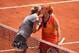 PARIS, FRANCE - MAY 31: Svetlana Kuznetsova of Russia kisses Petra Kvitova of Czech Republic at the net following her victory in their women's singles match on day seven of the French Open at Roland Garros on May 31, 2014 in Paris, France. (Photo by Mat