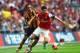 LONDON, ENGLAND - MAY 17: Mikel Arteta of Arsenal evades Ahmed Elmohamady of Hull City during the FA Cup with Budweiser Final match between Arsenal and Hull City at Wembley Stadium on May 17, 2014 in London, England. (Photo by Shaun Botterill/Getty Imag