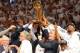 Jun 20, 2013; Miami, FL, USA; Miami Heat president Pat Riley holds the Larry O'Brien Championship trophy after defeating the San Antonio Spurs in game seven in the 2013 NBA Finals at American Airlines Arena. Miami Heat won 95-88 to win the NBA Championshi