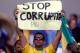BELO HORIZONTE, BRAZIL - JUNE 22: A fan holds up a sign reading 'Stop Corruption' during the FIFA Confederations Cup Brazil 2013 Group A match between Japan and Mexico at Estadio Mineirao on June 22, 2013 in Belo Horizonte, Brazil. (Photo by Ronald Mart