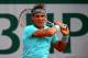 PARIS, FRANCE - JUNE 04: Rafael Nadal of Spain returns a shot during his men's singles quarter-final match against David Ferrer of Spain on day eleven of the French Open at Roland Garros on June 4, 2014 in Paris, France. (Photo by Dan Istitene/Getty Ima
