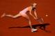 PARIS, FRANCE - JUNE 05: Maria Sharapova of Russia returns a shot during her women's singles semi-final match against Eugenie Bouchard of Canada on day twelve of the French Open at Roland Garros on June 5, 2014 in Paris, France. (Photo by Clive Brunskil