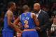 Apr 15, 2014; Brooklyn, NY, USA; New York Knicks head coach Mike Woodson talks with guard Raymond Felton (2) and guard J.R. Smith (8) during the first quarter against the Brooklyn Nets at Barclays Center. Mandatory Credit: Anthony Gruppuso-USA TODAY Spo