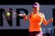 PARIS, FRANCE - JUNE 05: Simona Halep of Romania returns a shot during her women's singles match against Andrea Petkovic of Germany on day twelve of the French Open at Roland Garros on June 5, 2014 in Paris, France. (Photo by Matthew Stockman/Getty Imag