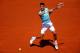 PARIS, FRANCE - JUNE 06: Novak Djokovic of Serbia returns a shot during his men's singles semi-final match against Ernests Gulbis of Latvia on day thirteen of the French Open at Roland Garros on June 6, 2014 in Paris, France. (Photo by Clive Brunskill/G