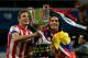 MADRID, SPAIN - MAY 17: Radamel Falcao (R) of Atletico de Madrid holds the trophy in celebration with his teammate Saul during the Copa del Rey Final match between Real Madrid CF and Club Atletico de Madrid at Estadio Santiago Bernabeu on May 17, 2013 in