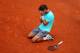 PARIS, FRANCE - JUNE 08: Rafael Nadal of Spain celebrates match point during his men's singles final match against Novak Djokovic of Serbia on day fifteen of the French Open at Roland Garros on June 8, 2014 in Paris, France. (Photo by Clive Brunskill/Ge