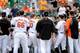 BALTIMORE, MD - JUNE 08: Players run onto the field after Manny Machado of the Baltimore Orioles threw a bat during the eighth inning against the Oakland Athletics at Oriole Park at Camden Yards on June 8, 2014 in Baltimore, Maryland. Machado was ejected