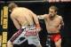 Nov 16, 2013; Las Vegas, NV, USA; Tim Elliott (red gloves) fights against Ali Bagautinov (blue gloves) in their flyweight bout during UFC 167 at MGM Grand Garden Arena. Mandatory Credit: Stephen R. Sylvanie-USA TODAY Sports